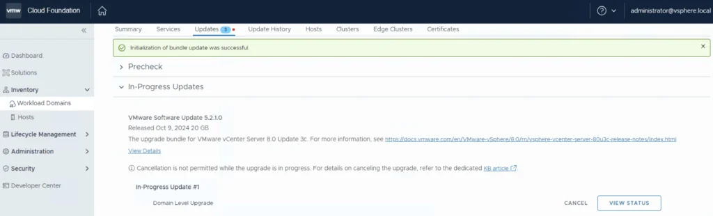 The image shows the “Updates” tab in VCF 5.2.1, displaying a successful bundle update and an in-progress upgrade.