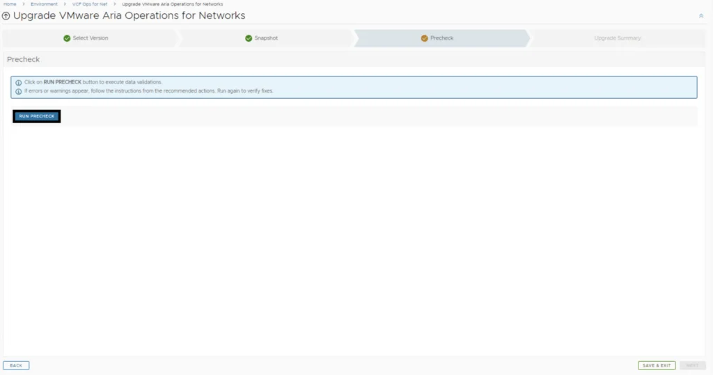 The image shows the Precheck step of an upgrade wizard for VMware Aria Operations for Networks. It prompts to run precheck and handle errors.